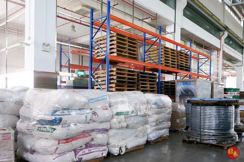 Bagged materials and cable reels on pallets in front of V3000 racking holding empty pallets above - V3000 Racking - V3-5 | Wong Lye Racking, Singapore Racking Manufacturer