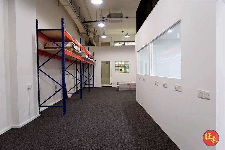 Blue and orange pallet racking bays beside the office partition, under the mezzanine floor - V5000 Racking - V5-13 | Wong Lye Racking, Singapore Racking Manufacturer
