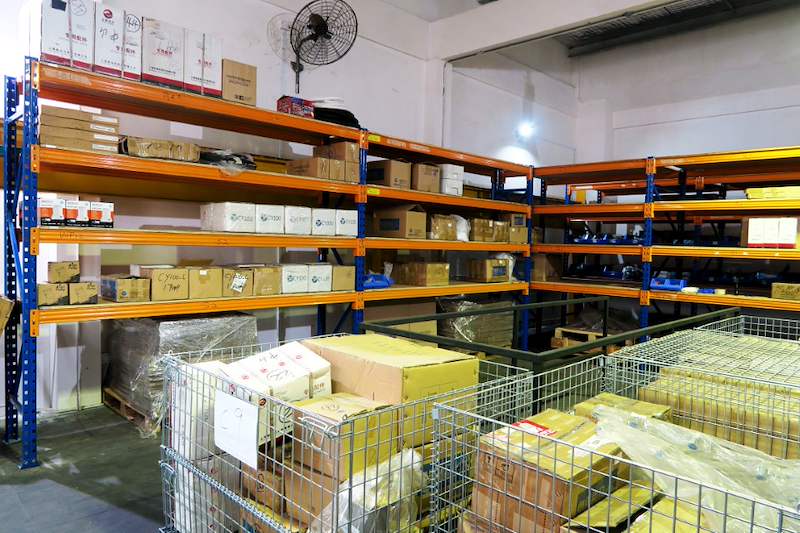 Wire mesh cages of parts on the mezzanine deck in front of loaded racking bays - V5000 Racking - V5-8 | Wong Lye Racking, Singapore Racking Manufacturer