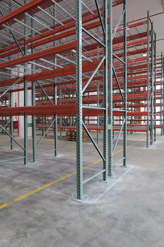 Green upright frame and orange beams at the corner of the pallet racking run - V3000 Racking - V3-3 | Wong Lye Racking, Singapore Racking Manufacturer