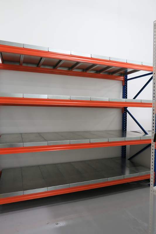 Long-span racking bay with blue uprights and orange beams in the corner of the store, empty - Boltless Racking - B8 | Wong Lye Racking, Singapore Racking Manufacturer