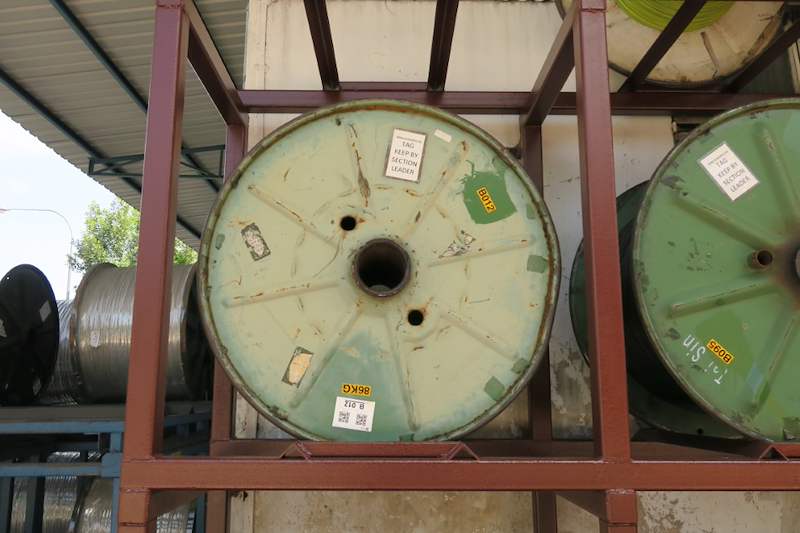 Cable drum on the upper tier of the welded steel rack, seen from the front under the shed roof - V5000 Racking - V5-1 | Wong Lye Racking, Singapore Racking Manufacturer