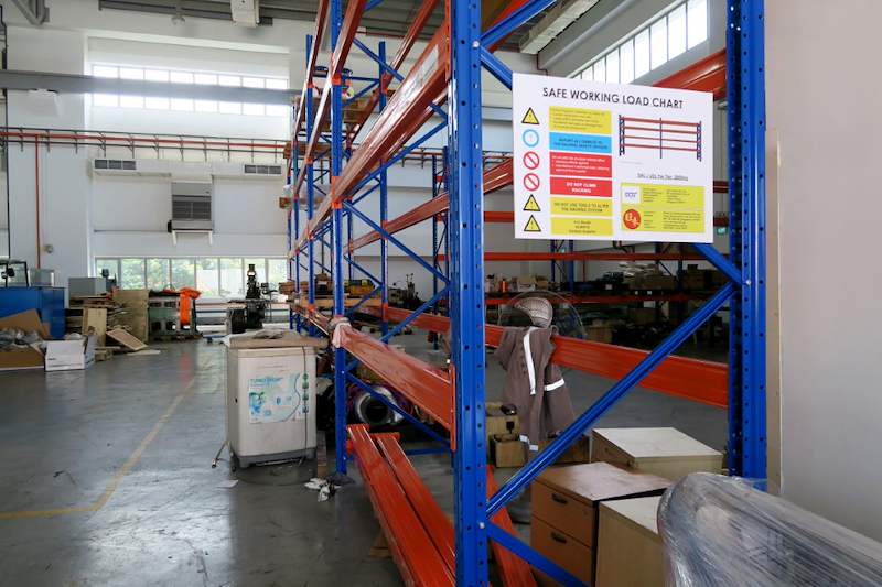 V3000 racking end frame with a safe working load chart mounted on the blue upright - V3000 Racking - V3-5 | Wong Lye Racking, Singapore Racking Manufacturer