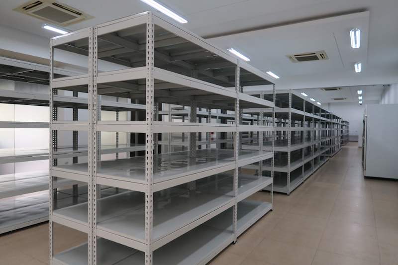 Grey boltless shelving units arranged in rows, five levels each, shelves empty - Boltless Racking - B5 | Wong Lye Racking, Singapore Racking Manufacturer