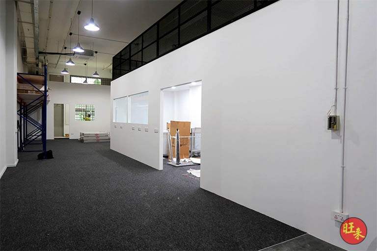 Office corridor under the mezzanine with pallet racking bays at the far end - V5000 Racking - V5-13 | Wong Lye Racking, Singapore Racking Manufacturer