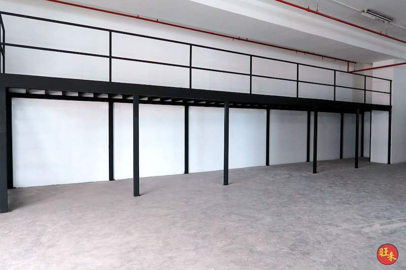 Black steel mezzanine deck with railing running the length of the unit, ground floor empty - V5000 Racking - V5-17 | Wong Lye Racking, Singapore Racking Manufacturer