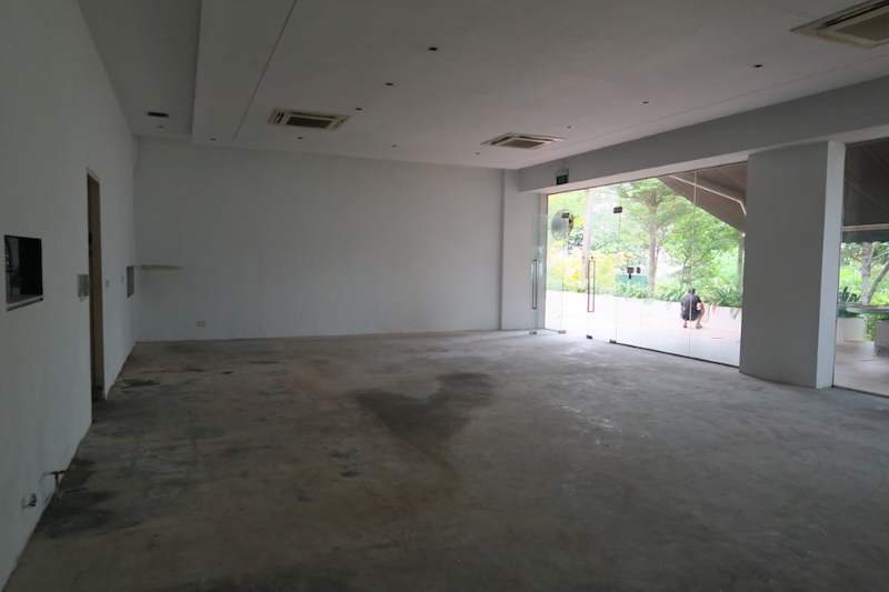 Before: bare unit interior with concrete floor and doorways, prior to the racking installation - Boltless Racking - B5 | Wong Lye Racking, Singapore Racking Manufacturer
