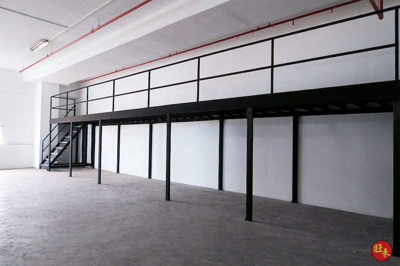 Black steel mezzanine floor and staircase along the wall of an empty unit - V5000 Racking - V5-17 | Wong Lye Racking, Singapore Racking Manufacturer