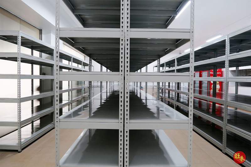 Aisle between two rows of grey boltless shelving, five steel shelf levels each side - Boltless Racking - B5 | Wong Lye Racking, Singapore Racking Manufacturer