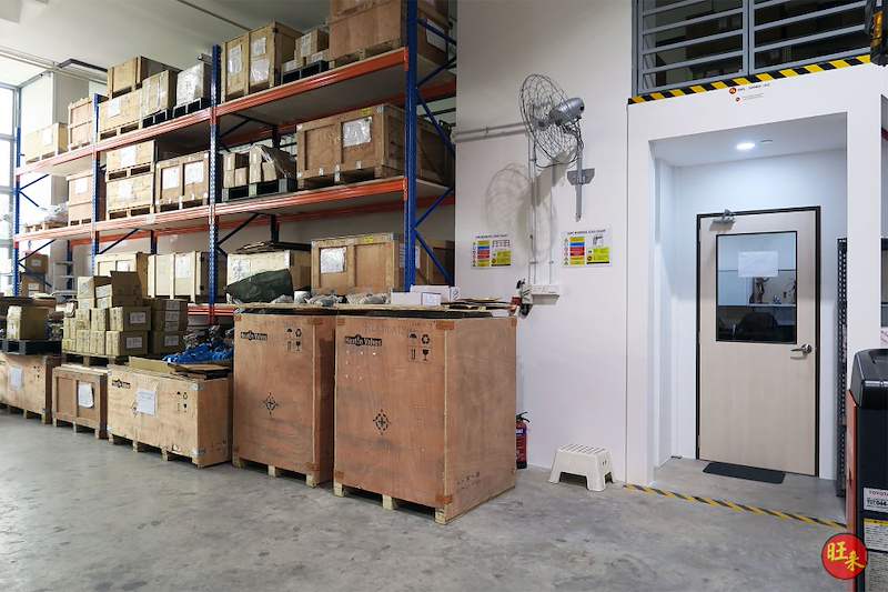 After: pallet racking bays loaded with crates and cartons beside the mezzanine deck above the doorway - V5000 Racking - V5-19 | Wong Lye Racking, Singapore Racking Manufacturer