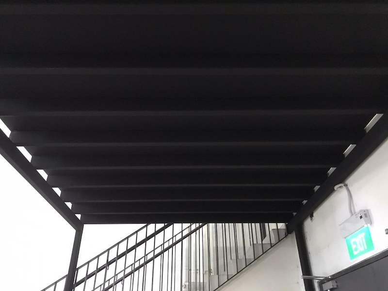 Mezzanine platform underside with steel joists and the top of the staircase balustrade - V5000 Racking - V5-9 | Wong Lye Racking, Singapore Racking Manufacturer