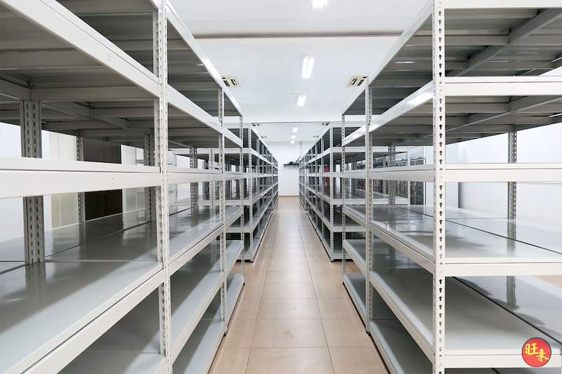 Rows of boltless shelving with a central aisle in the tiled store room - Boltless Racking - B5 | Wong Lye Racking, Singapore Racking Manufacturer