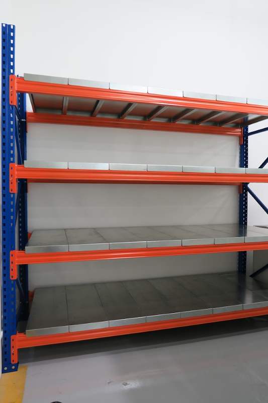 Side view of the blue-and-orange long-span racking bay with four levels of steel decking - Boltless Racking - B8 | Wong Lye Racking, Singapore Racking Manufacturer