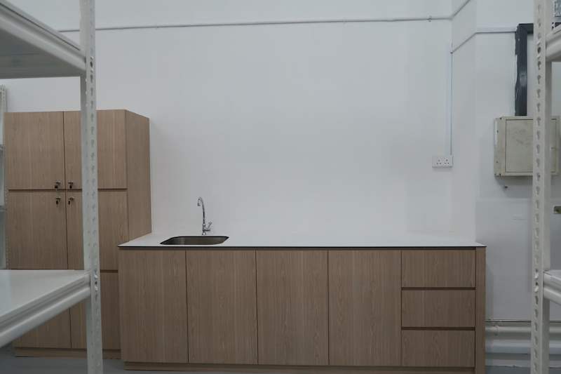 Pantry sink counter and cabinets between two white boltless shelving units - Boltless Racking - B8 | Wong Lye Racking, Singapore Racking Manufacturer