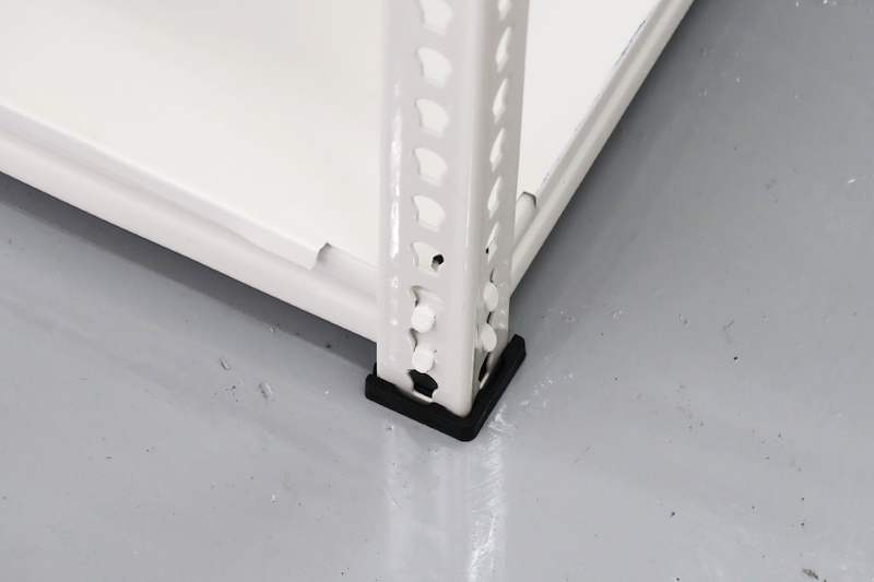 Foot of a white boltless shelving upright with a black plastic base cap on the epoxy floor - Boltless Racking - B8 | Wong Lye Racking, Singapore Racking Manufacturer