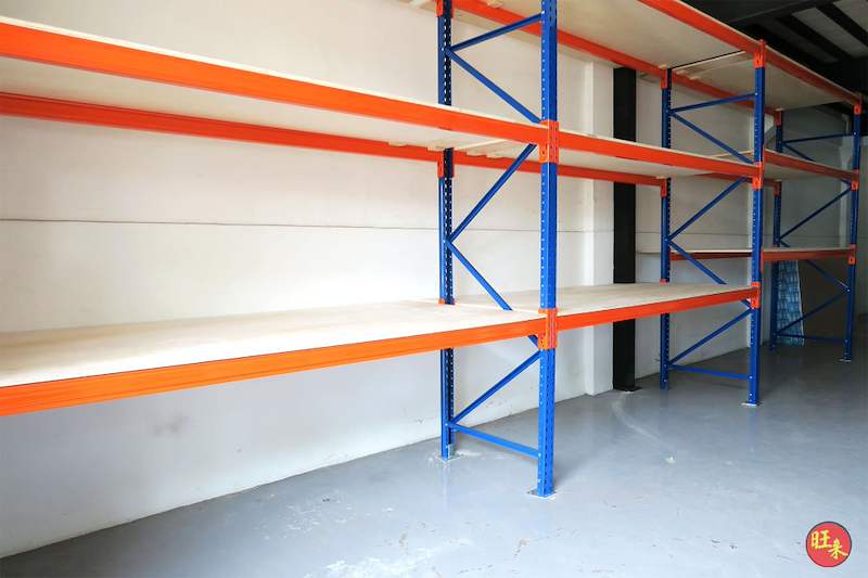 V3000 racking bays with orange beams and plywood decking on blue uprights, decks empty - V3000 Racking - V3-2 | Wong Lye Racking, Singapore Racking Manufacturer