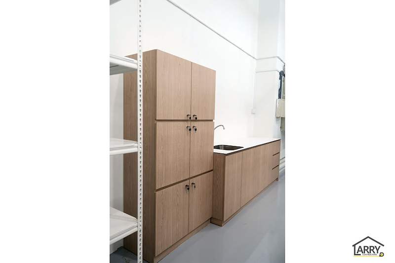 Timber-laminate pantry cabinets and sink beside a white boltless shelving unit - Boltless Racking - B8 | Wong Lye Racking, Singapore Racking Manufacturer