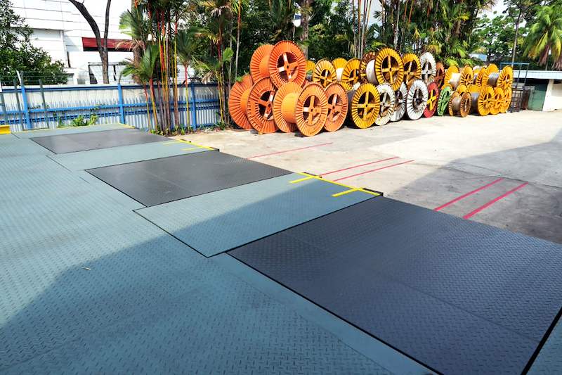 Steel chequer-plate platforms in the yard with cable drums stored in the background - V10000 Racking - V10-1 | Wong Lye Racking, Singapore Racking Manufacturer
