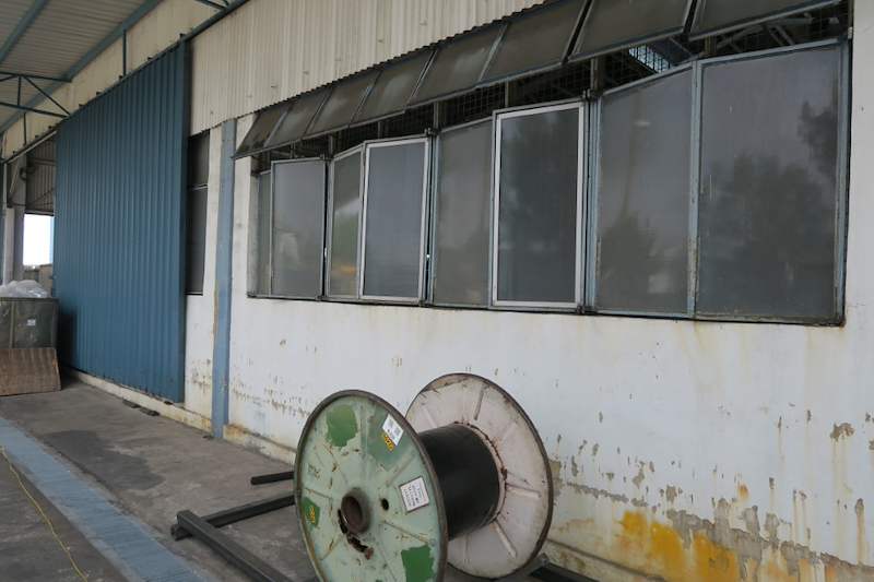 Cable drum on the ground beside the wall where the rack will be installed - V5000 Racking - V5-1 | Wong Lye Racking, Singapore Racking Manufacturer