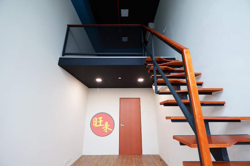 Timber-tread staircase with steel handrail leading to the mesh-railed loft mezzanine - V5000 Racking - V5-26 | Wong Lye Racking, Singapore Racking Manufacturer