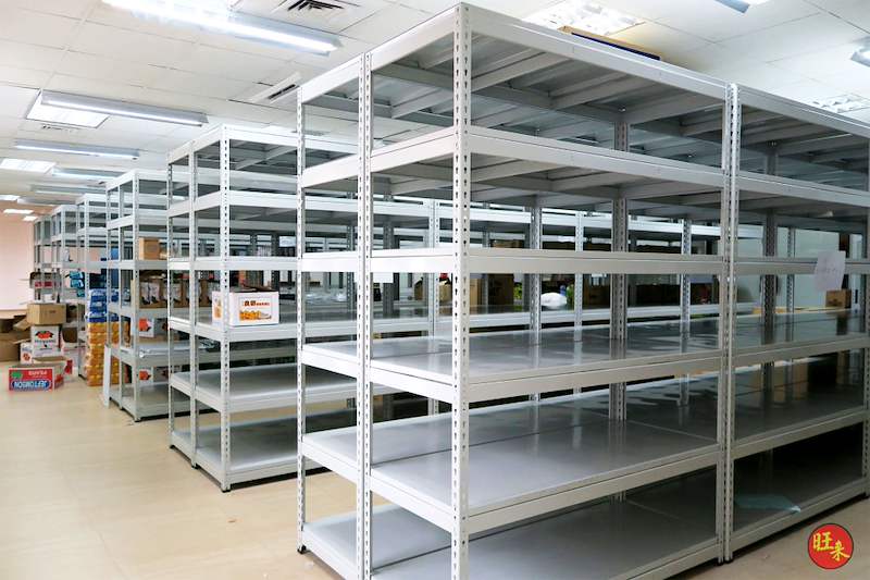 Rows of grey boltless shelving with steel shelves across the store, mostly empty - Boltless Racking - B2 | Wong Lye Racking, Singapore Racking Manufacturer