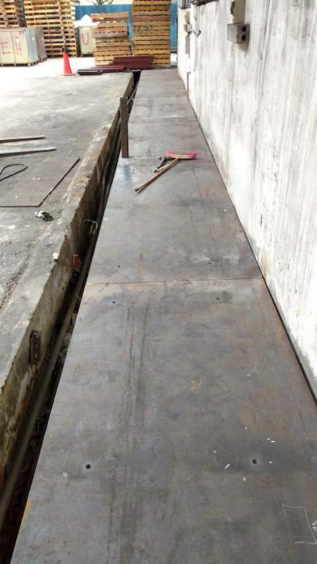 Steel base plate laid along the kerb, drilled ready for the uprights - V5000 Racking - V5-1 | Wong Lye Racking, Singapore Racking Manufacturer