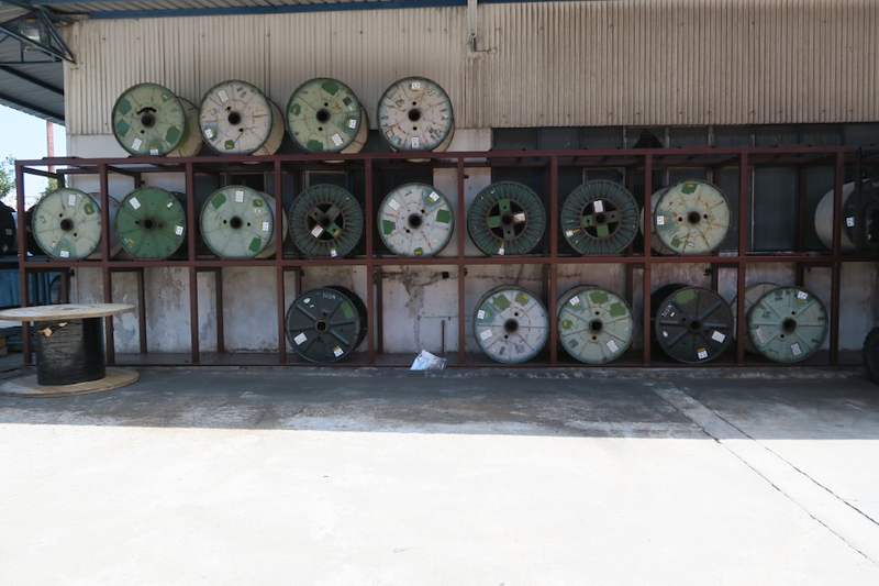 After: two-tier steel rack along the wall fully loaded with cable drums - V5000 Racking - V5-1 | Wong Lye Racking, Singapore Racking Manufacturer