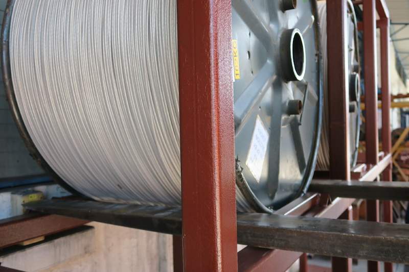 Close view of a cable drum on the rack's upper tier cradle beam - V5000 Racking - V5-1 | Wong Lye Racking, Singapore Racking Manufacturer