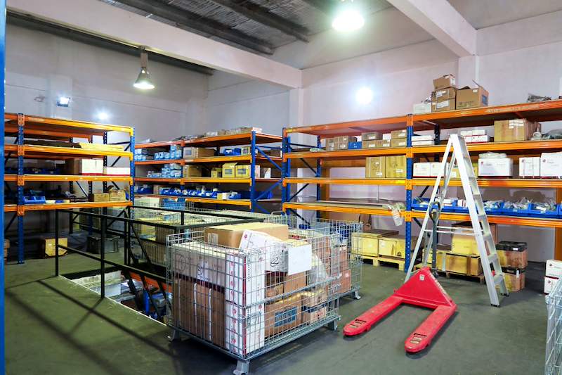 Upper mezzanine deck with blue-and-orange racking bays and wire mesh cages of stock, ladder in the aisle - V5000 Racking - V5-8 | Wong Lye Racking, Singapore Racking Manufacturer