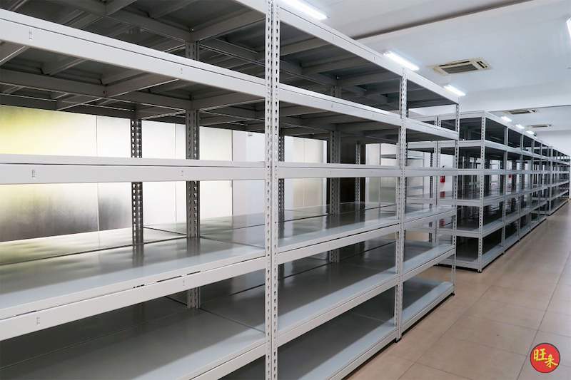 Grey boltless shelving rows with five shelf levels, viewed from the corner of the room - Boltless Racking - B5 | Wong Lye Racking, Singapore Racking Manufacturer