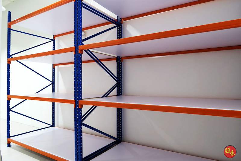 Long-span racking bays with three white decked levels on blue uprights and orange beams - Boltless Racking - B3 | Wong Lye Racking, Singapore Racking Manufacturer