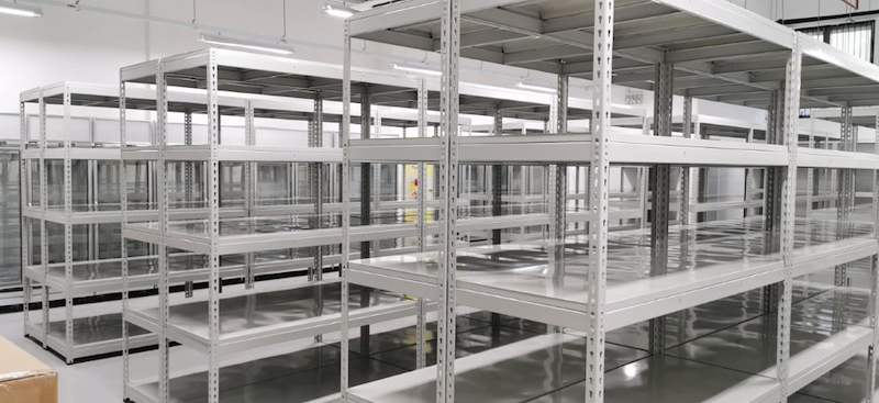 Rows of grey boltless shelving with five steel levels filling the store, all empty - Boltless Racking - B1 | Wong Lye Racking, Singapore Racking Manufacturer