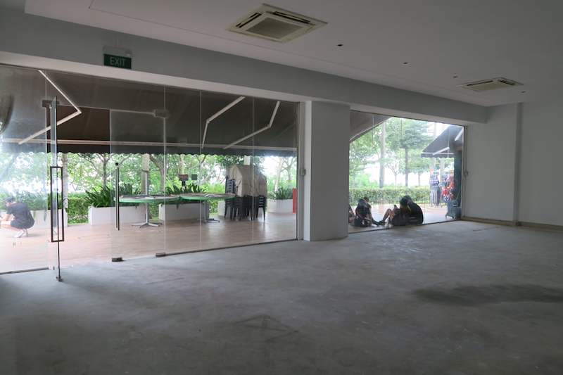Before: empty ground-floor unit with glass frontage before the racking installation - Boltless Racking - B5 | Wong Lye Racking, Singapore Racking Manufacturer