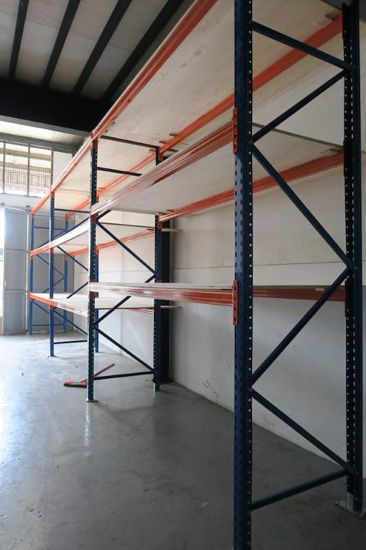 V3000 racking bays with orange beams and plywood decking, viewed along the aisle - V3000 Racking - V3-2 | Wong Lye Racking, Singapore Racking Manufacturer