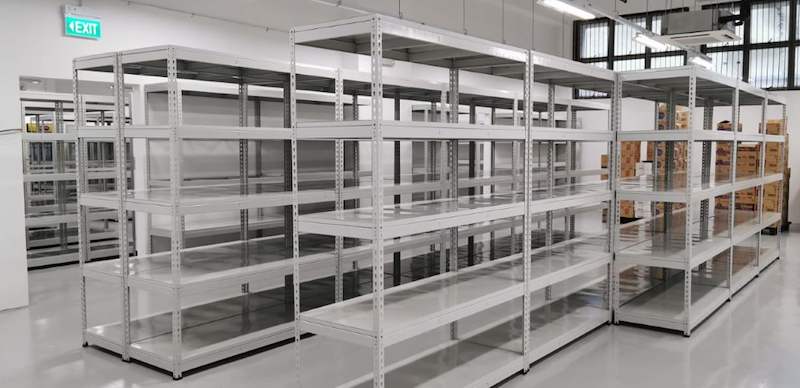 Rows of grey boltless shelving across the store with cartons of stock at the far end - Boltless Racking - B1 | Wong Lye Racking, Singapore Racking Manufacturer