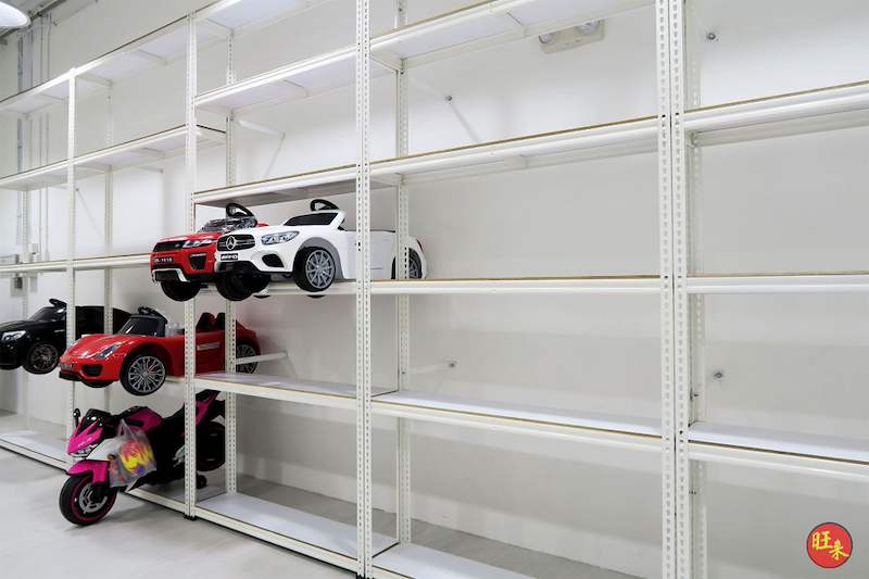 Long run of white boltless shelving with toy cars on the lower shelves, most bays empty - Boltless Racking - B3 | Wong Lye Racking, Singapore Racking Manufacturer