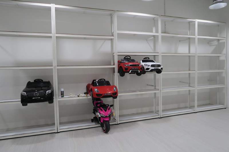 Wide view of the white boltless shelving run with toy cars displayed at one end - Boltless Racking - B3 | Wong Lye Racking, Singapore Racking Manufacturer