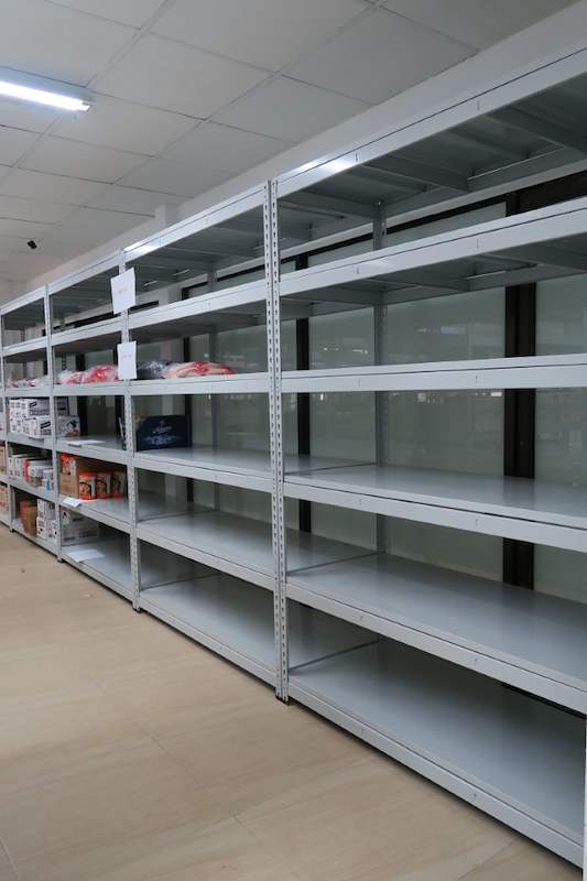 Boltless shelving bays along the wall with a few cartons on the shelves - Boltless Racking - B2 | Wong Lye Racking, Singapore Racking Manufacturer