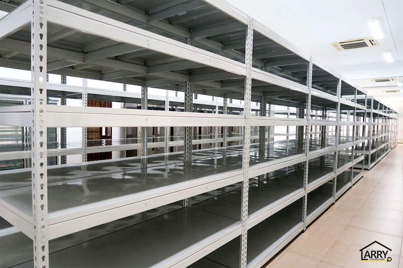 Rows of boltless shelving with steel shelf panels running the length of the tiled room - Boltless Racking - B5 | Wong Lye Racking, Singapore Racking Manufacturer