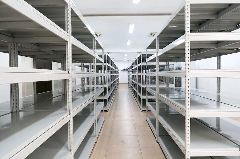 Centre aisle between rows of grey boltless shelving, all shelves empty - Boltless Racking - B5 | Wong Lye Racking, Singapore Racking Manufacturer